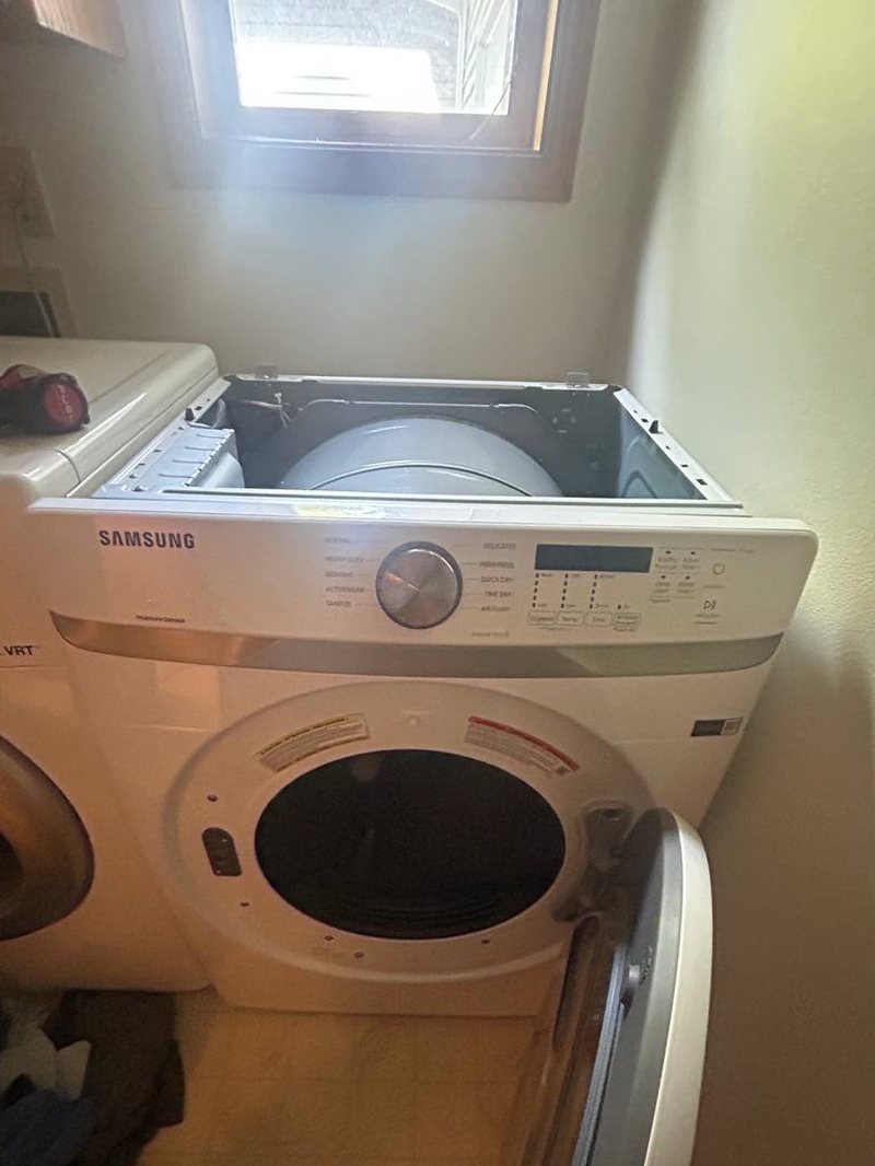 Samsung front-load dryer with the door open after a heating element replacement