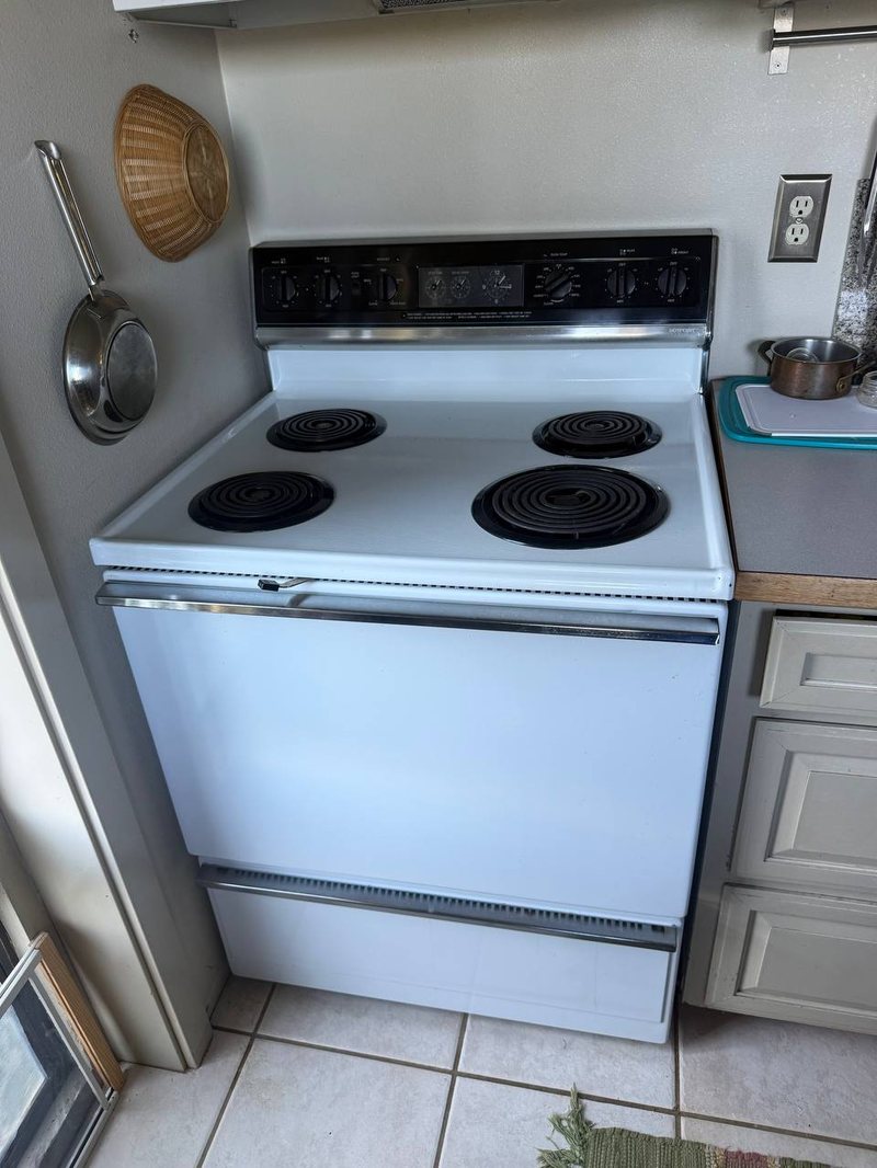 White Hotpoint coil-top electric range in an Eastside kitchen before a burner and oven test