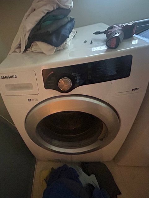 Samsung front-load washer beside its dryer in a West Olympia laundry closet